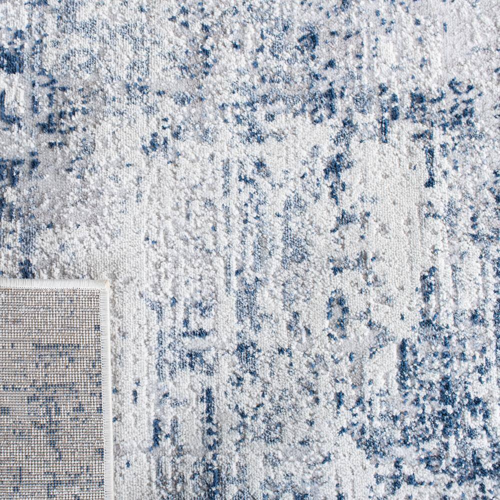 Ivory and Navy Abstract 8' x 10' Synthetic Area Rug