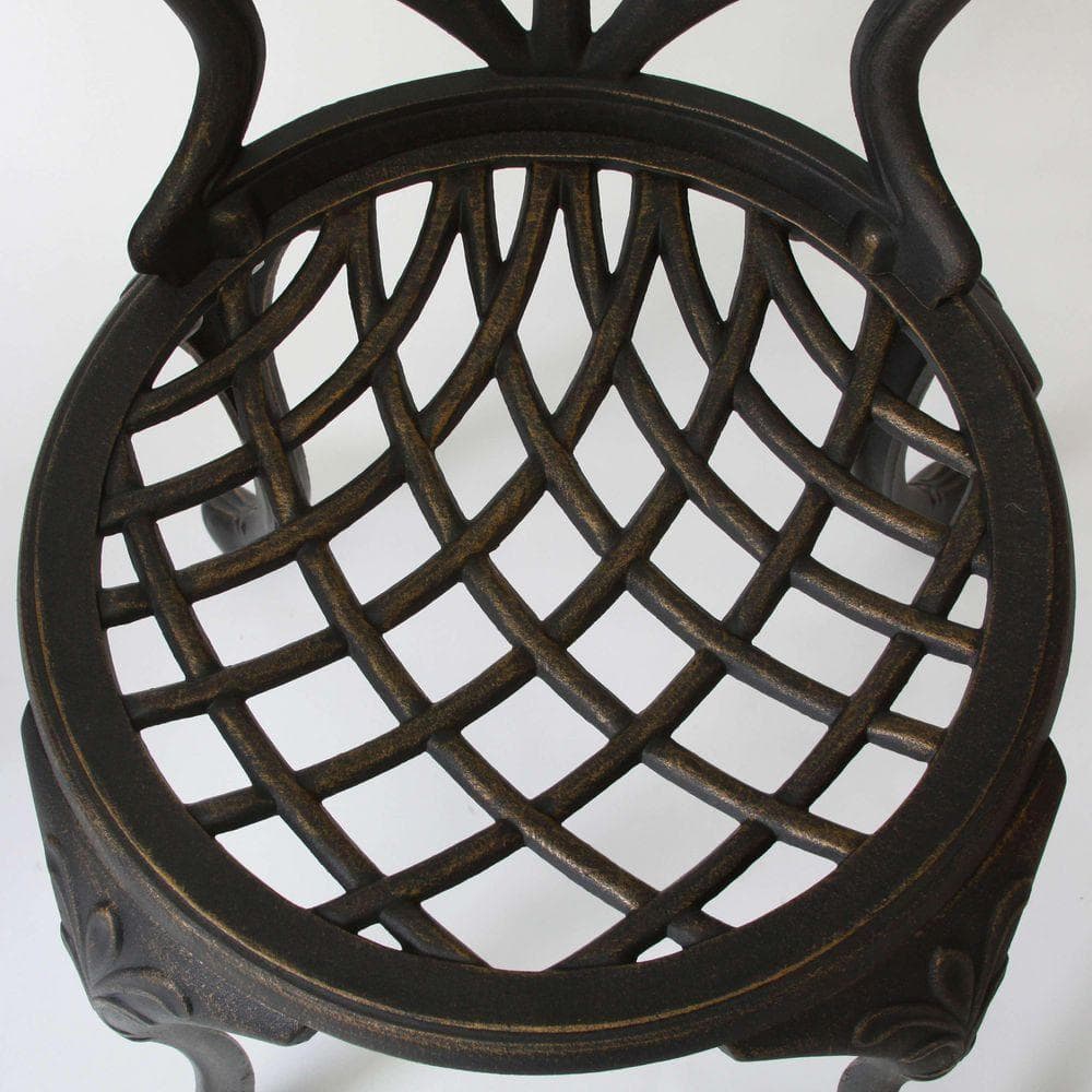 Close-up of the criss-cross lattice seat of a black aluminum chair.