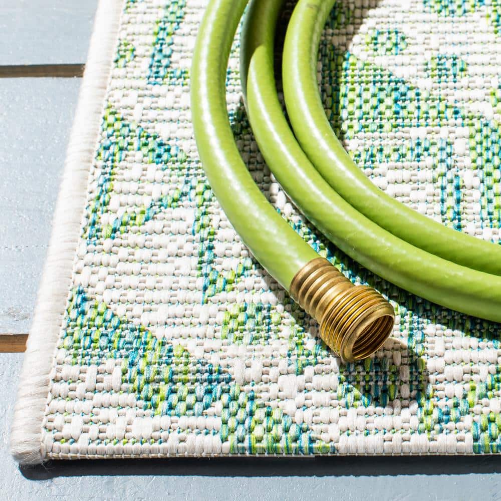 Ivory and Green Medallion 8' x 10' Synthetic Area Rug