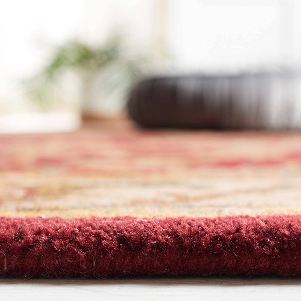 Hand-Tufted Red and Ivory Wool Oval Area Rug 8' x 10'