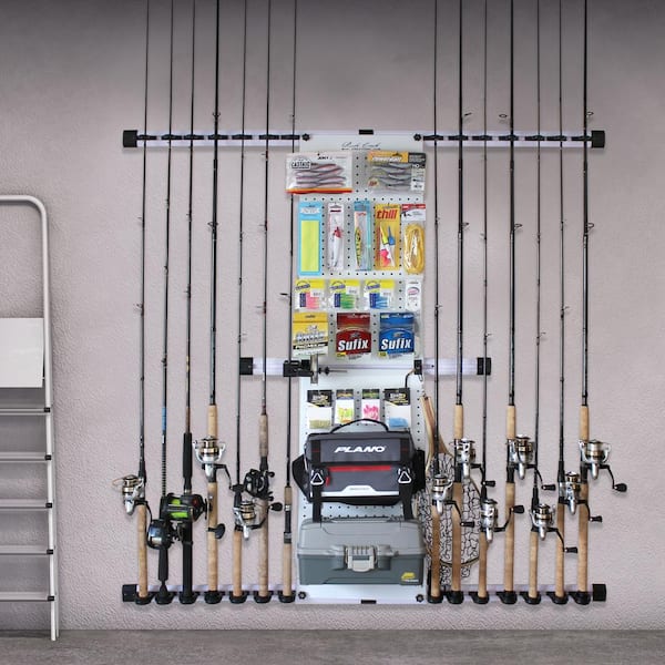 Fishing rod storage on garage door uses U-bolts to hold rods and allow them  to rotate when the door opens.