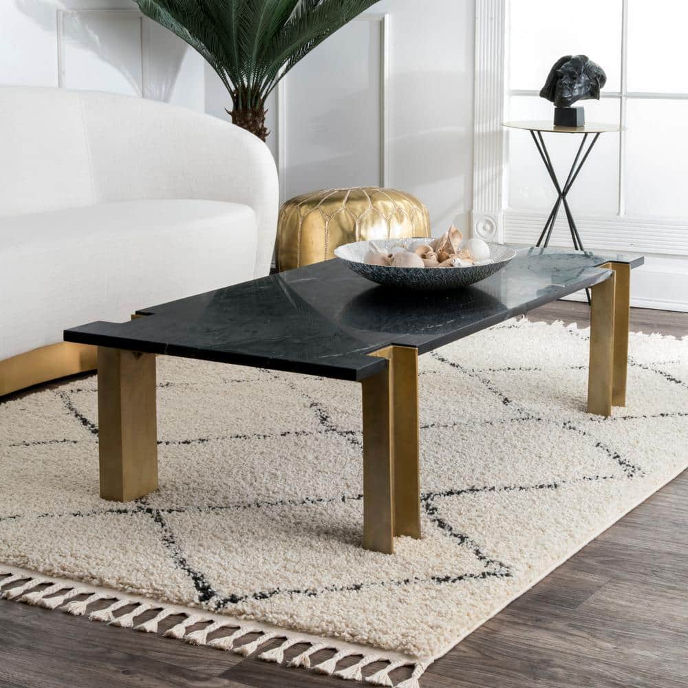 Off-White 6' 7" x 9' Oval Synthetic Shag Area Rug with Tassels