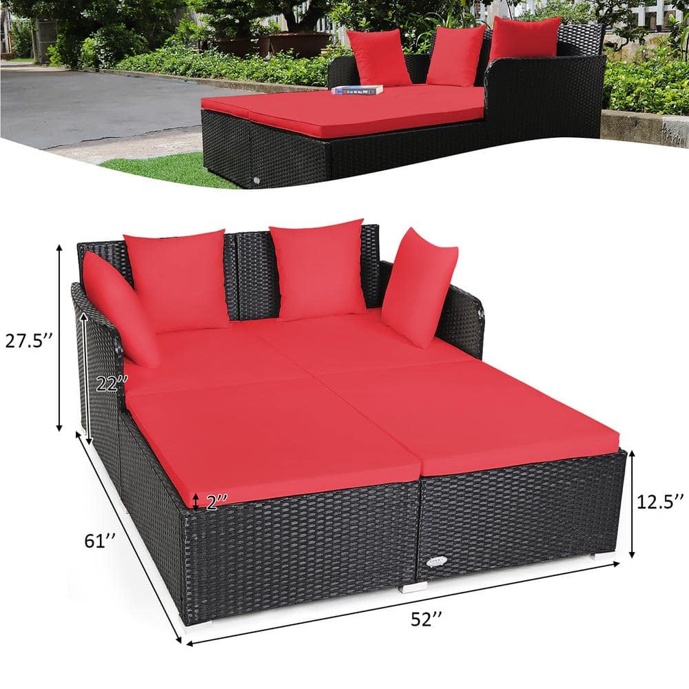 Outdoor Black Rattan Daybed with Red Cushions and Pillows