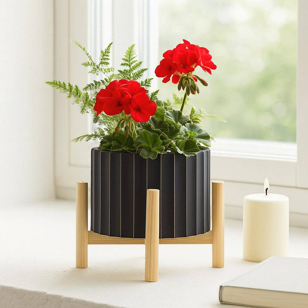 Liv & Skye 8 in. Black Ceramic Fluted Planter with Wood Stand