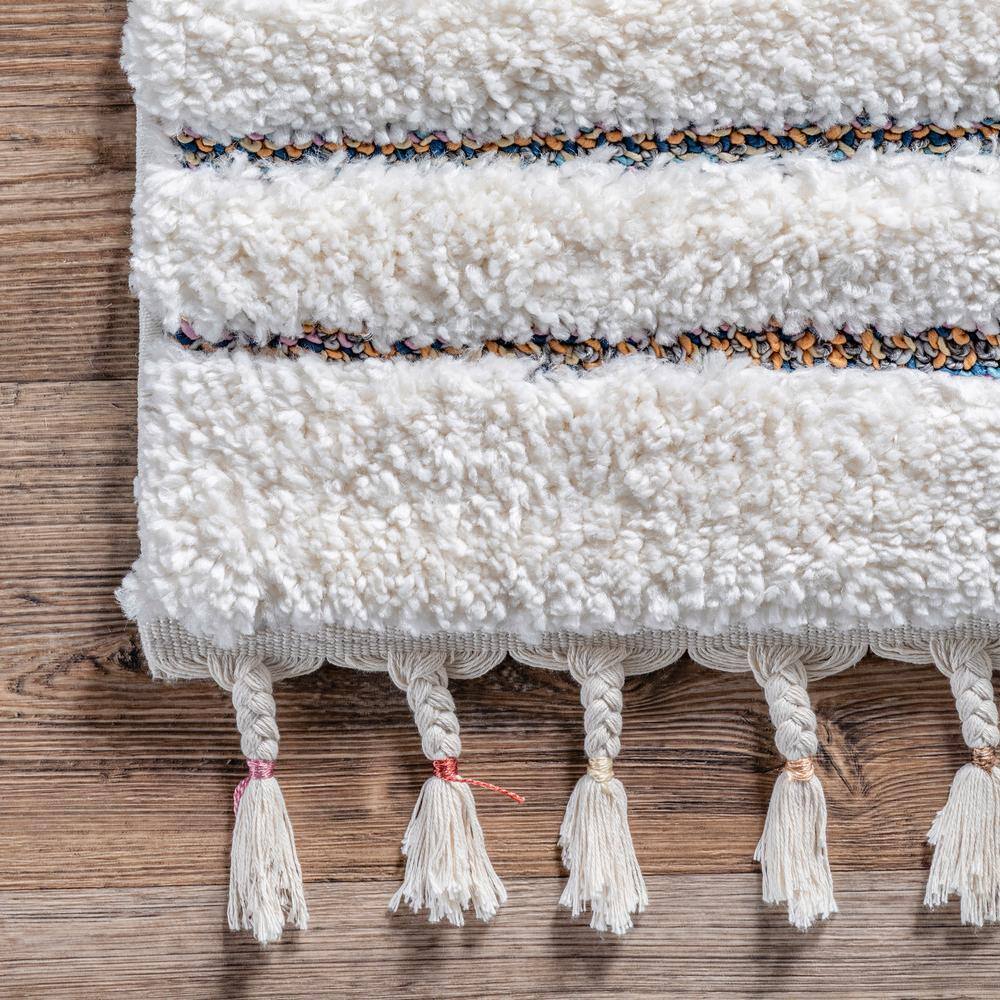 Ivory Geometric Synthetic Rectangular Area Rug with Braided Tassels