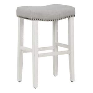 Jameson 29 in. Bar Height Antique White Wood Backless Nailhead Trim Barstool with Upholstered Gray Linen Saddle Seat