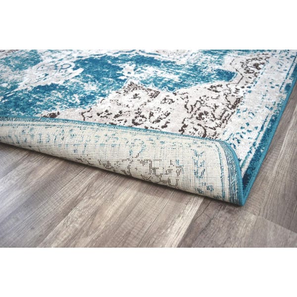 https://images.thdstatic.com/productImages/12974829-d083-4bf6-9e4e-87eea81aca11/svn/avalon-teal-rugs-america-area-rugs-ra28025-66_600.jpg