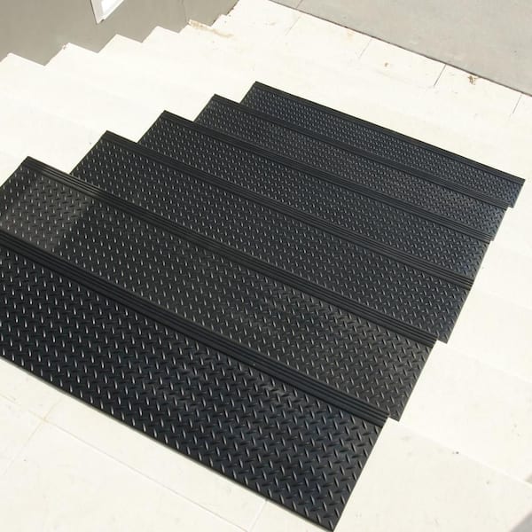 https://images.thdstatic.com/productImages/12ce3868-3aed-4f11-865e-b16c706c8790/svn/black-rubber-cal-stair-tread-covers-10-104-014-6pk-e1_600.jpg
