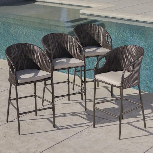 Noble House Dominica Stackable Faux Rattan Outdoor Bar Stool with Light Brown Cushion (4-Pack)