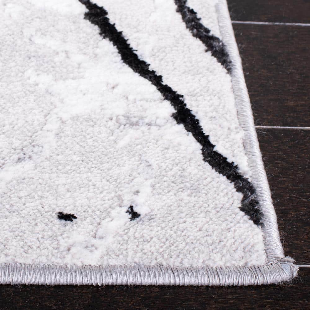 Handmade Round Gray and Black Abstract Synthetic Rug