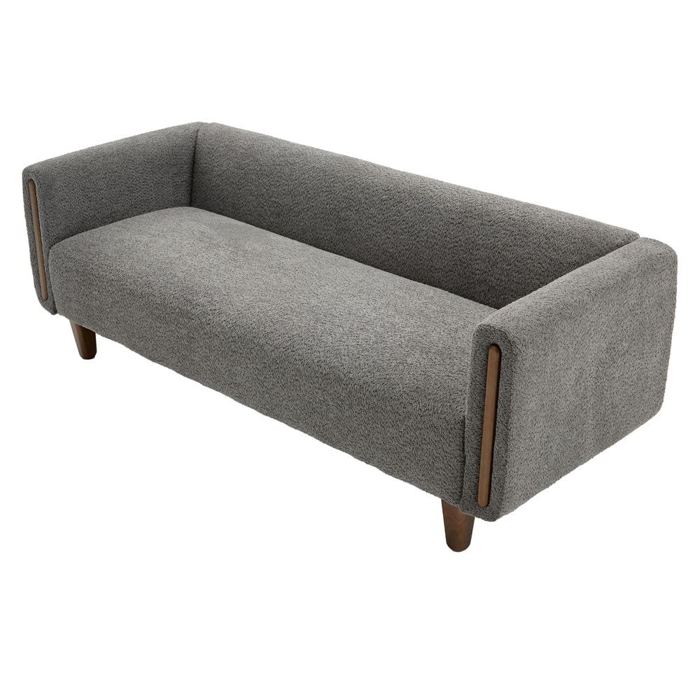 Three-quarter view of a modern gray sofa.