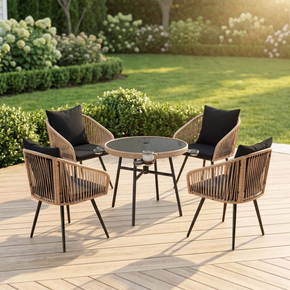 Outdoor dining set on a wooden deck at sunset.