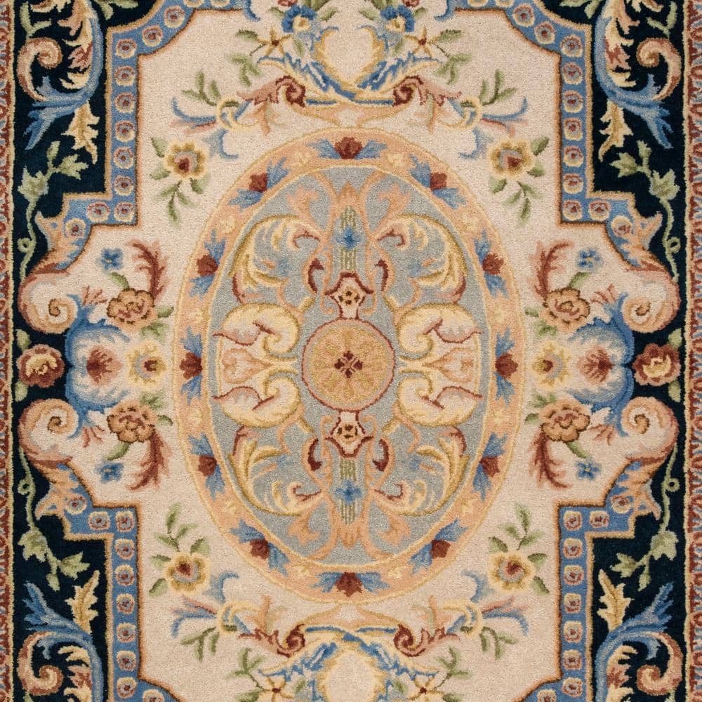 Ivory and Navy Handmade Wool Floral Area Rug
