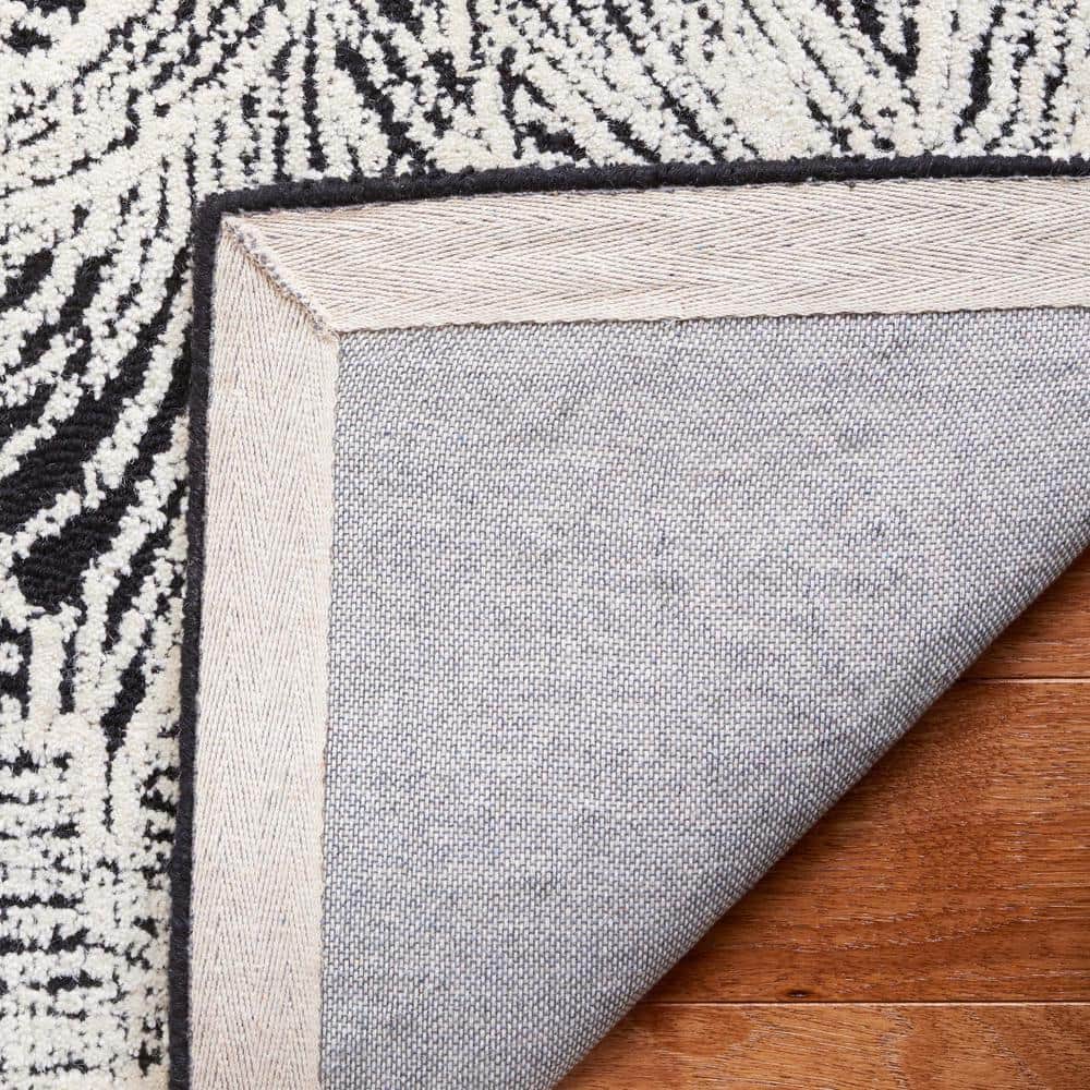 Ebony Black and Ivory Hand Tufted Wool Area Rug
