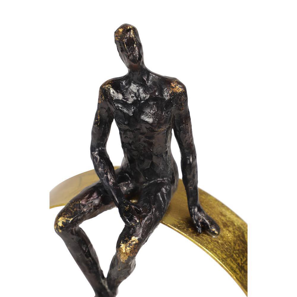Black and Gold Resin Human Figurine on Circular Base