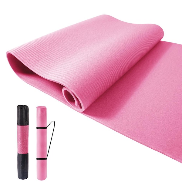 Premium Photo  Pink yoga mat, rolled up.