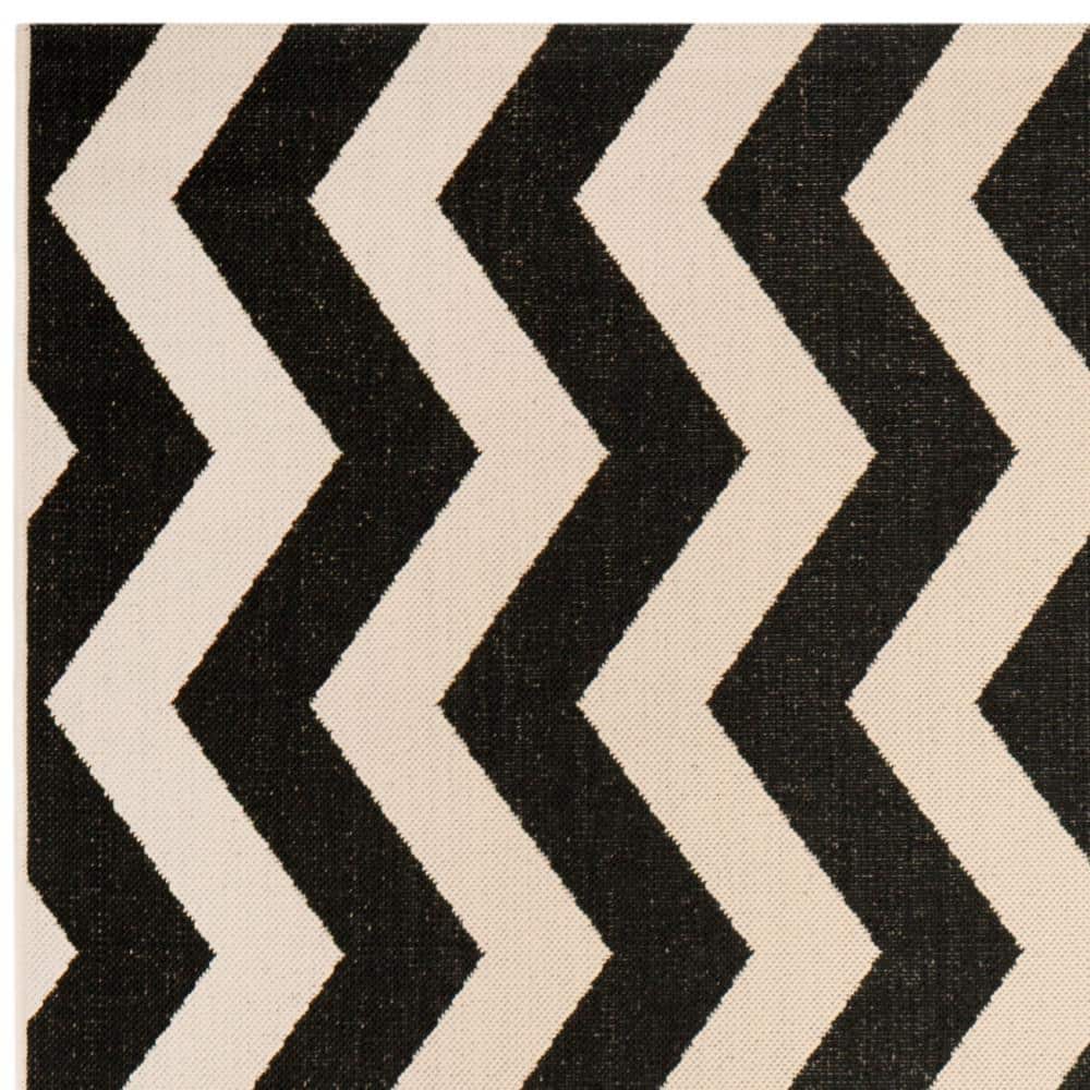 Courtyard Collection 54" Round Black/Beige Synthetic Area Rug