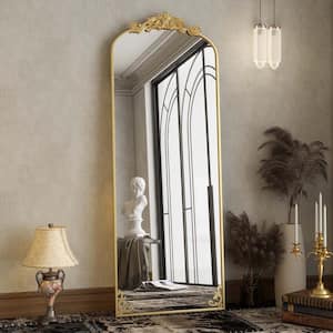 21 in. W x 64 in. H Arched Gold Metal Framed with Carved Decoration Full Length Mirror