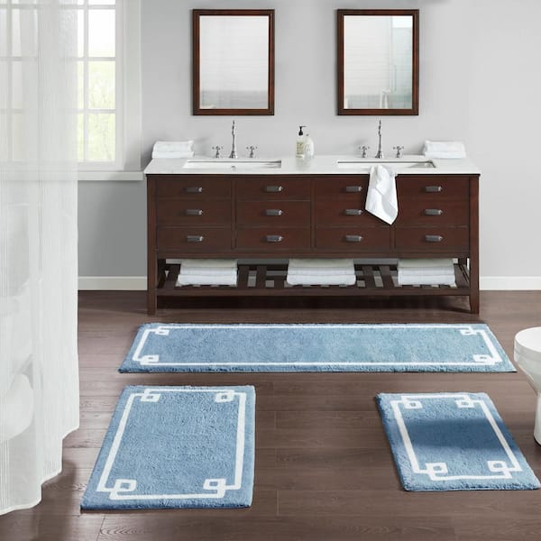 https://images.thdstatic.com/productImages/138a5592-6fb4-4de0-8543-f41bf78847c9/svn/blue-madison-park-bathroom-rugs-bath-mats-mp72-6208-44_600.jpg