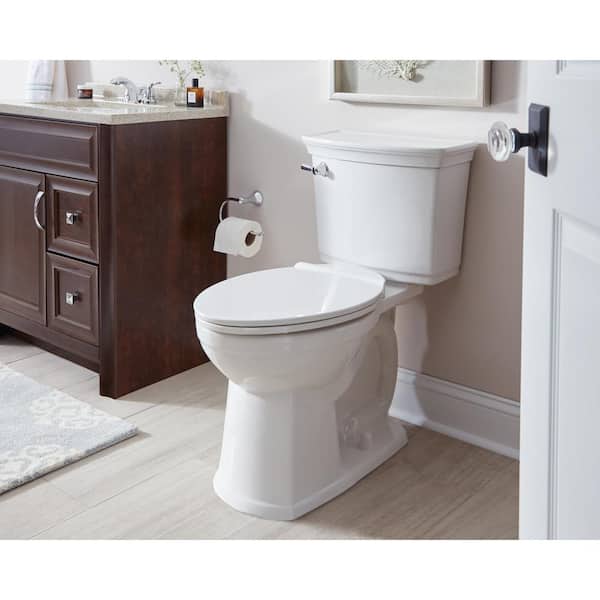 https://images.thdstatic.com/productImages/139abe82-5f78-4f21-bc58-5a18b9980ba5/svn/white-american-standard-two-piece-toilets-708aa101-020-64_600.jpg