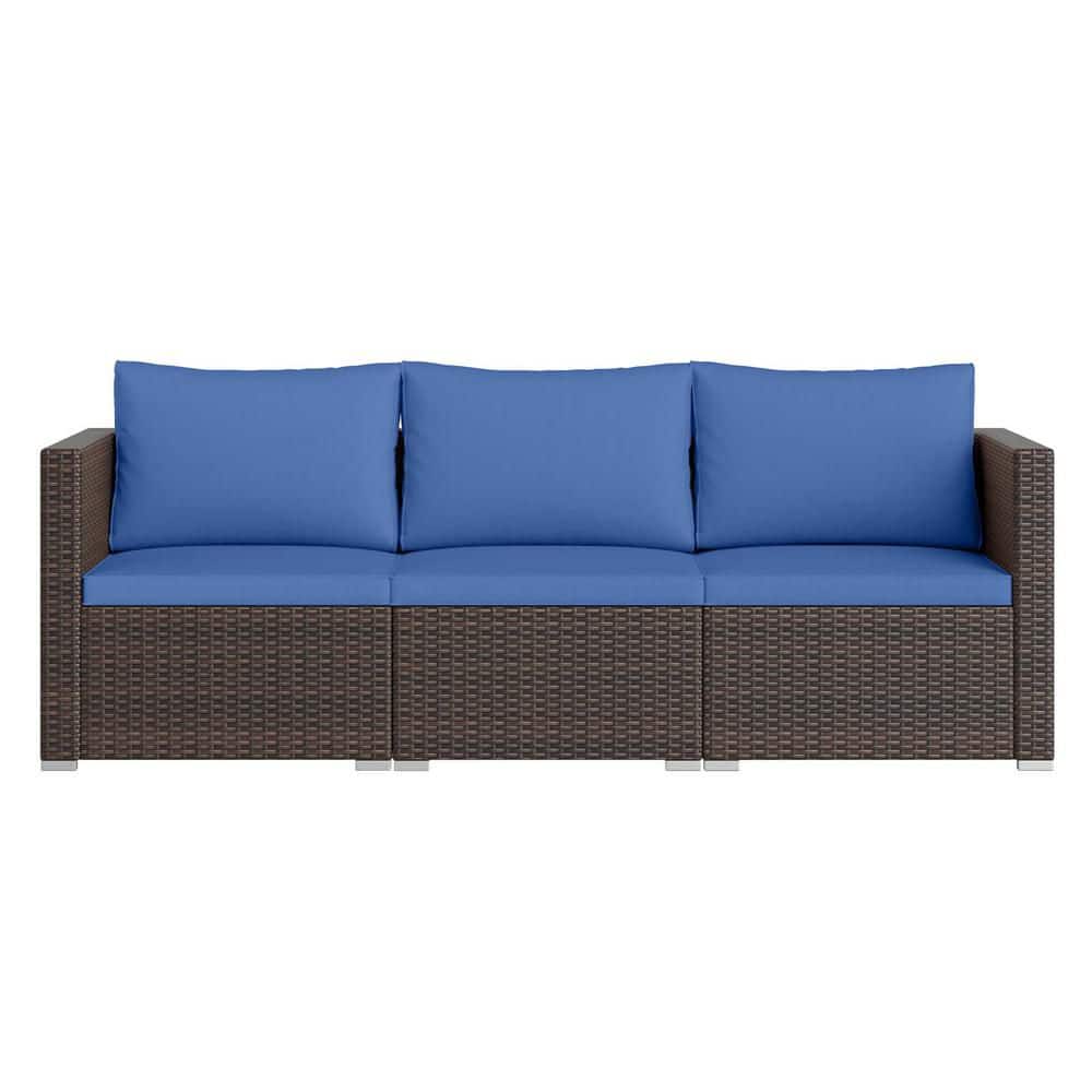 A three-seater patio sofa with dark brown wicker and navy blue cushions on a white background.