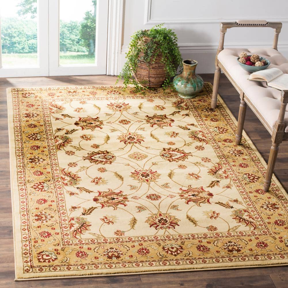 Ivory and Beige 12' x 15' Hand-Knotted Synthetic Area Rug