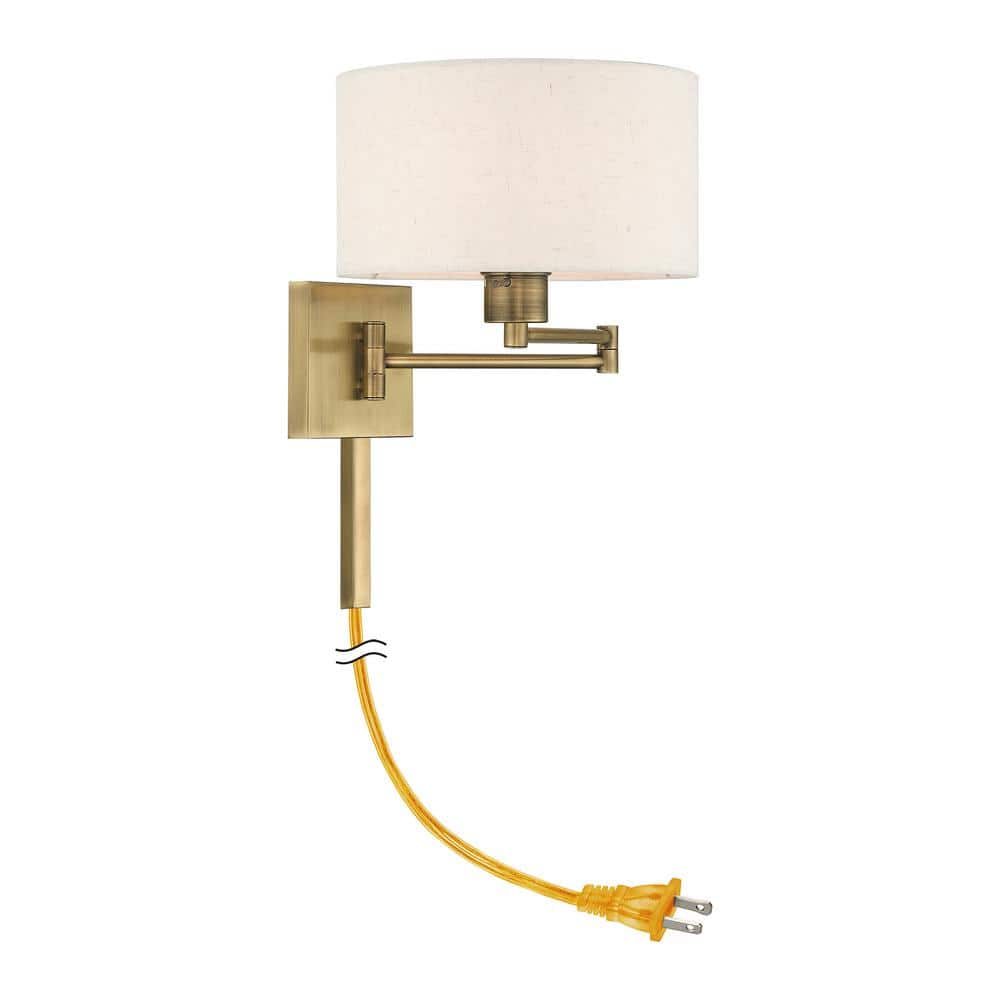 Antique Brass Swing Arm Wall Lamp with Oatmeal Shade