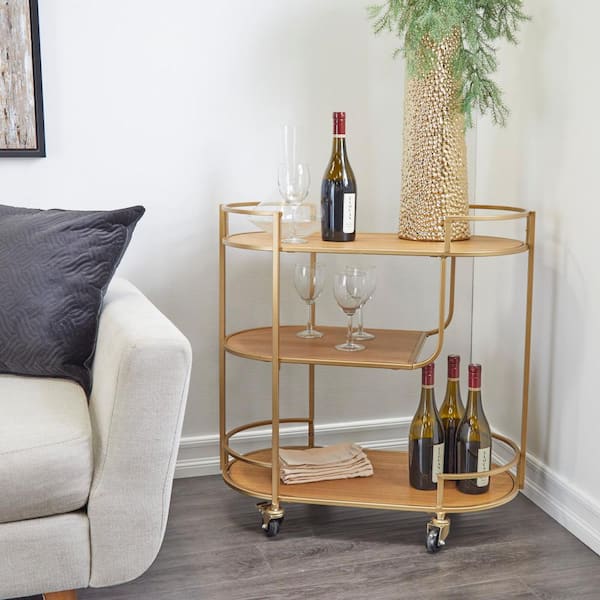 Litton Lane Gold Bar Cart with Oval Shape