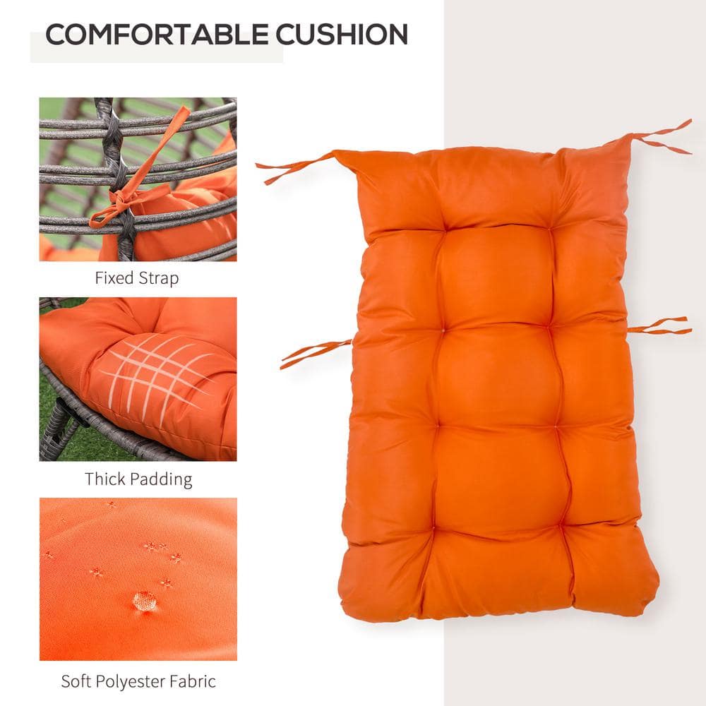 Gray Wicker Teardrop Chair with Orange Cushions