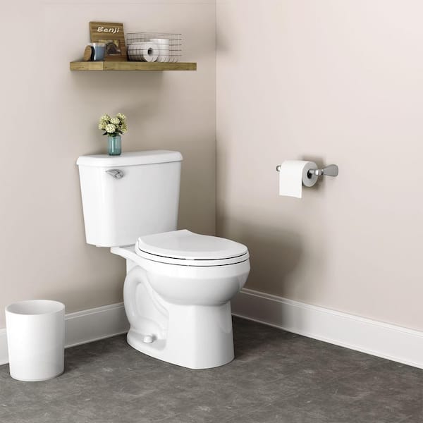 American Standard Reliant Two-Piece 10 in Rough 1.28 GPF Single Flush Round Standard Height Toilet with Slow-Close Seat in White