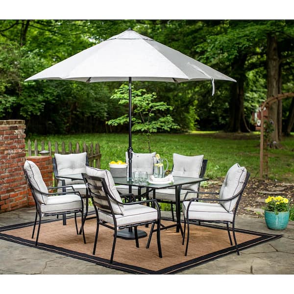 Hanover Lavallette 7-Piece Glass-Top Rectangular Patio Dining Set with Umbrella, Base and Silver Linings Cushions