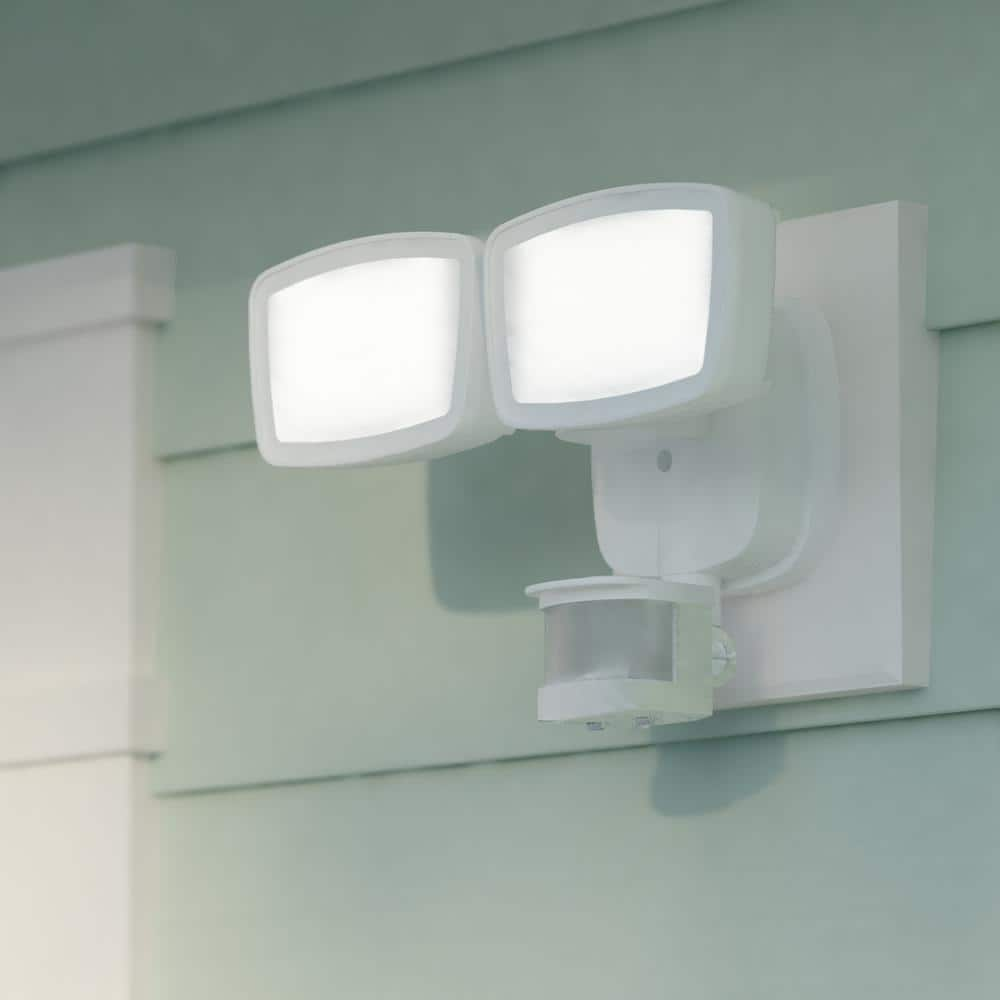 VAXCEL 180-Degree Range - 70 ft. White Outdoor Integrated LED Motion Sensor Dusk to Dawn Security Flood Light