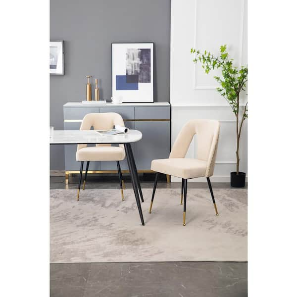 beige dining chairs with black legs