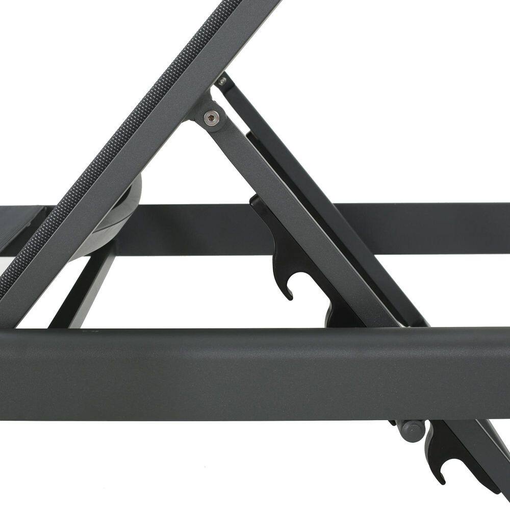 Close-up detail of the metal frame and pivot mechanism of the chaise lounge.