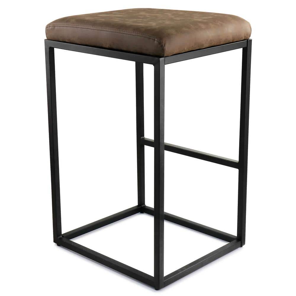 Three-quarter view of a brown faux leather backless bar stool with a black metal frame.