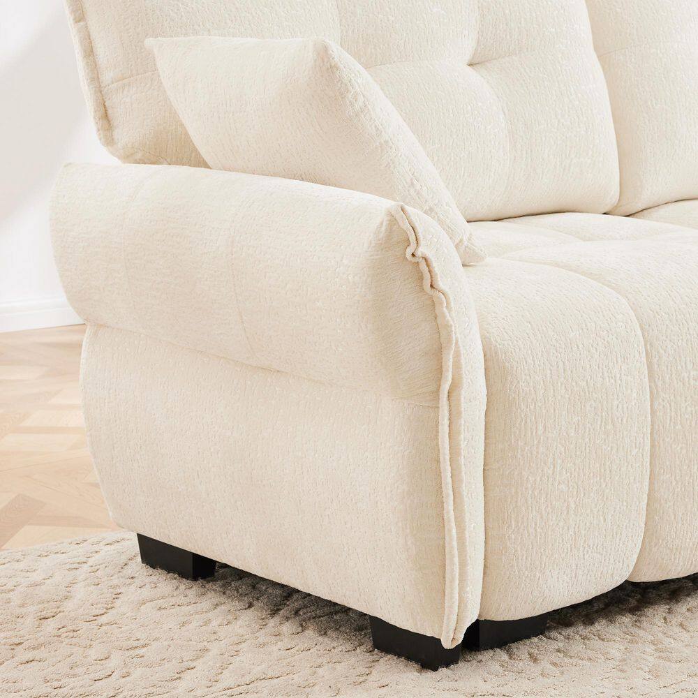Close-up of the rounded armrest and side of a beige chenille sofa.