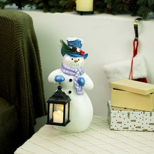 Alpine Corporation Lavender Winter Snowman Holding Lantern Statue