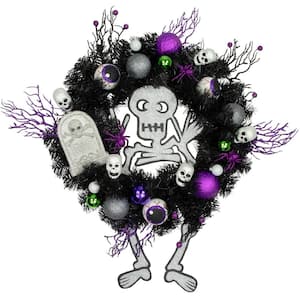 24 in. Purple and Black Unlit Spooky Skeleton Pine Halloween Wreath