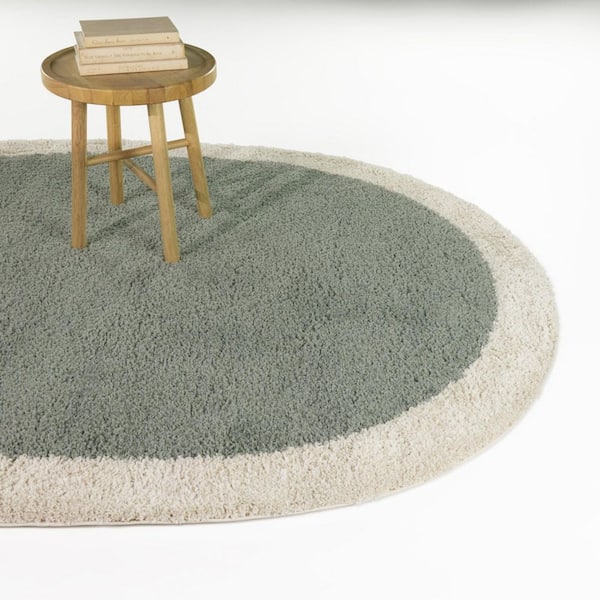 Odelle Cream 7 ft. x 9 ft. Oval Solid Border Area Rug