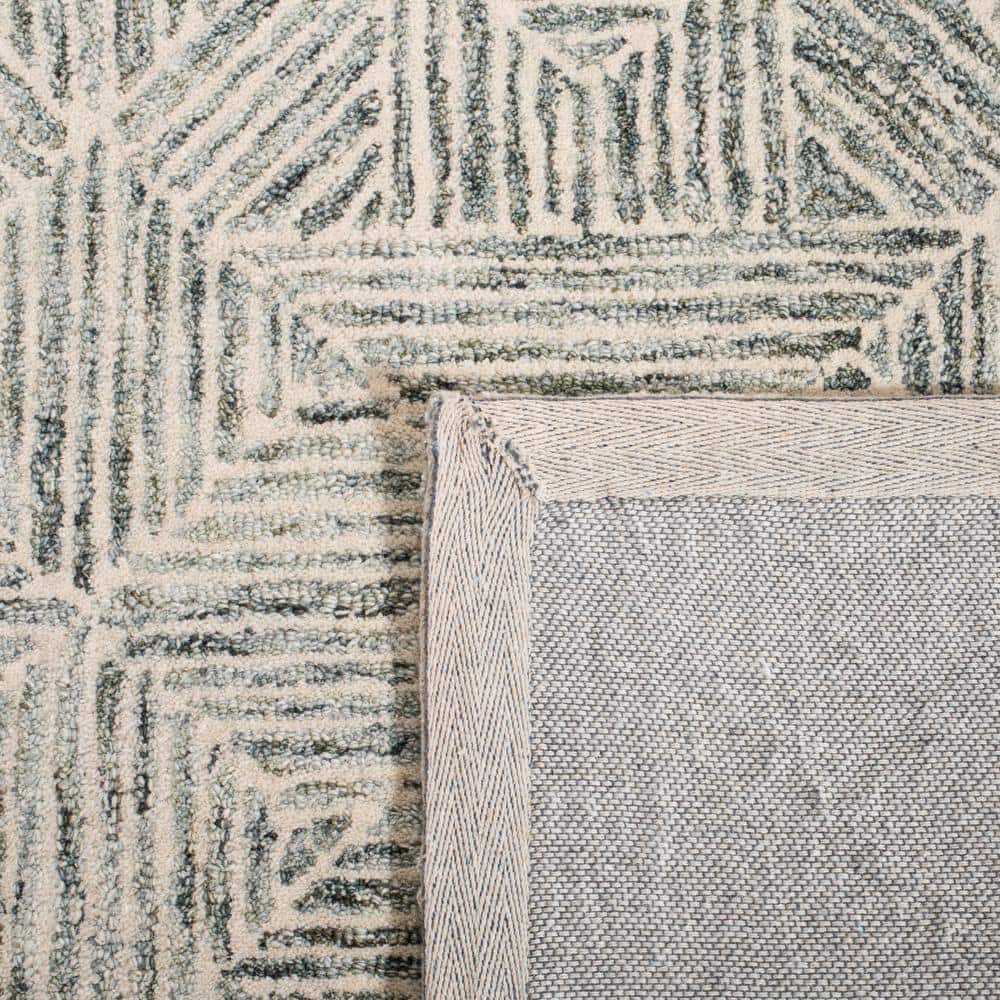 Handmade Round Green and Ivory Abstract Wool Rug