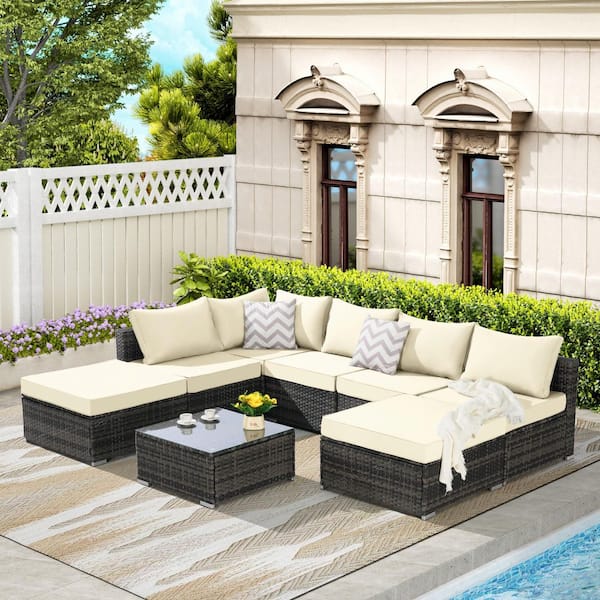 Noble House Cora Gray 8-Piece Outdoor PE Rattan and Metal Patio Conversation Set with Beige Cushions, Glass Table Top