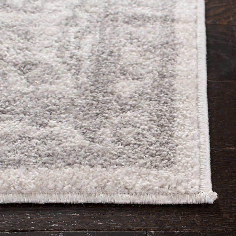 Ivory and Silver Synthetic 8' x 10' Easy-Care Rectangular Rug