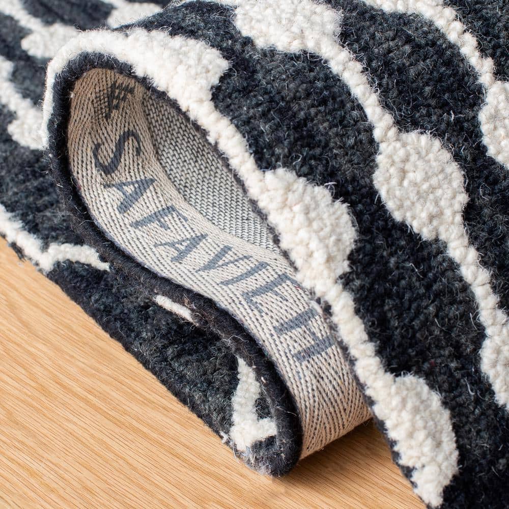 Black and Ivory 8' x 10' Handmade Wool Tufted Area Rug