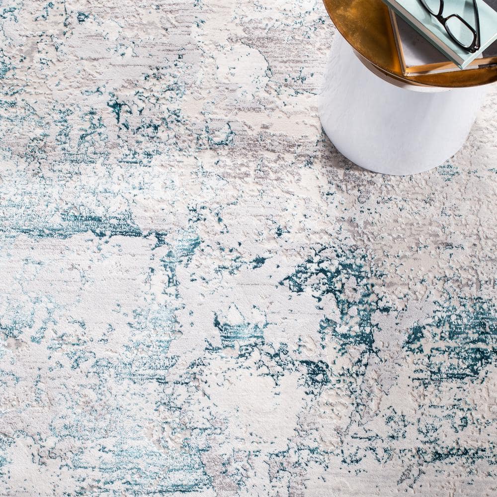 Cream and Turquoise Abstract Rectangular Area Rug 5'3" x 7'6"