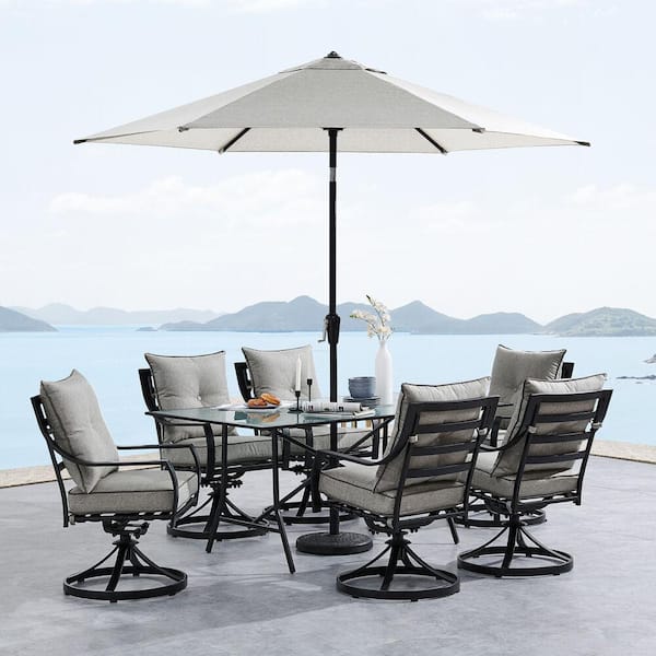 Hanover Lavallette 7-Piece Steel Outdoor Dining Set with Silver Linings Cushions, Swivel Rockers, Table, Umbrella and Base