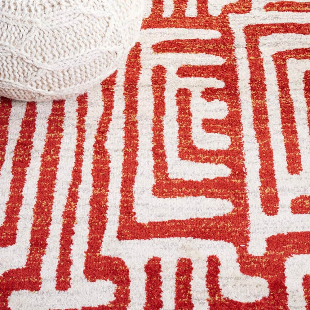 Ivory and Terracotta Geometric Synthetic Area Rug