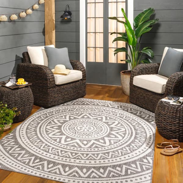 https://images.thdstatic.com/productImages/169ba3a6-da5e-5ea8-8d85-db490fe1f5e9/svn/taupe-gray-artistic-weavers-outdoor-rugs-lbh2317-537-31_600.jpg