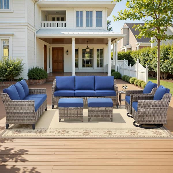 Glissia 7-Piece Gray Wicker Patio Conversation Set with Swivel Gliders and 4 in. Olefin Navy Blue Cushions