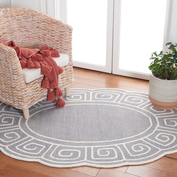 Novelty 6 ft. x 9 ft. Gray/Ivory Swirl Border Oval Area Rug