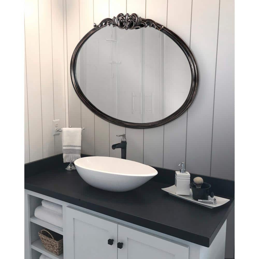 Black Oval Wood Wall Mirror with Intricate Overlay